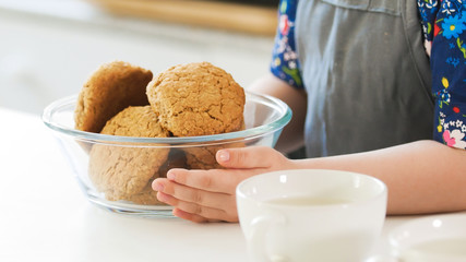 Little girl holds homemade cookies