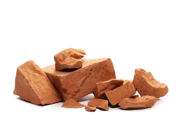 Shattered brick pieces isolated on white background