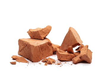 Shattered brick pieces isolated on white background