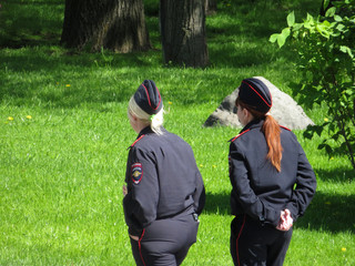 Two russian female police officers patrol the summer park. Russian police, fotball in Russia, safety tourism
