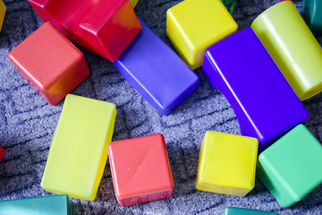 a lot of colorful foam cubes