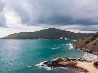 Drone view of blue ocean and orange mountains