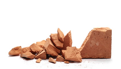Shattered brick pieces isolated on white background