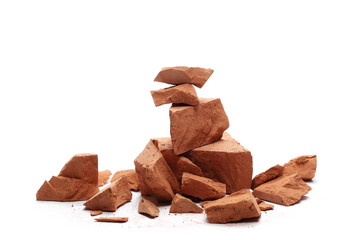 Shattered brick pieces isolated on white background