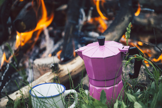 Mug and a geyser coffee maker.
