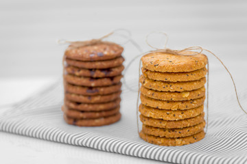Still life of freshly baked chocolate chip cookies on plate on table.