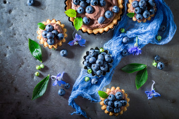 Homemade tarts made of fresh berries and brown cream
