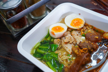 Noodles soup with pork leg and egg