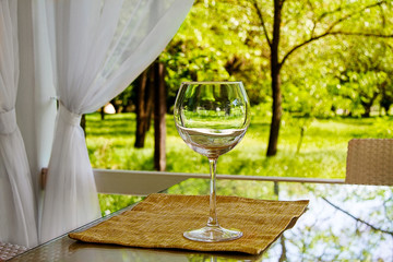 empty goblet on high stalk empty in gazebo.