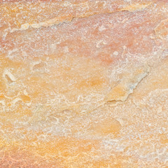 Yellow natural stone texture and background seamless