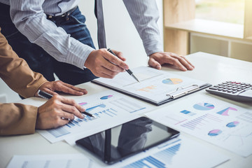 Business people conference and discussing the charts and graphs showing the results of their successful teamwork, business concept