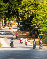 BAGAN, MYANMAR - DECEMBER 1, 2016: City landscape. Transport on the road. Copy space for text.