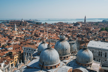 Naklejka premium Venice view from above - domes of Saint Mark's Basilica and ancient architecture.