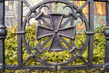 decorative forging, the symbol of the Christianity of the cross on the fence