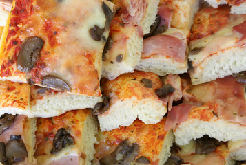 sliced pizza with mushroom and tomato mozzarella