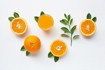 Fresh orange citrus fruit with leaves and Orange juice isolated on white background.  Top view