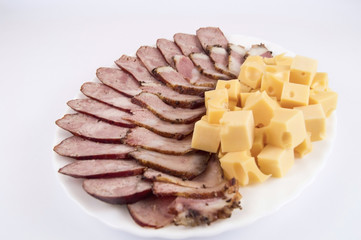 Delicious bacon with homemade sausage and hard cheese