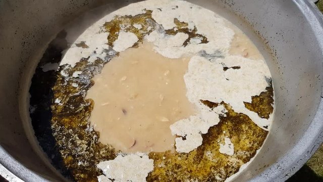 Polish soup zurek in a large saucepan in the open air