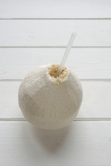 coconut fruit with drinking straw to drink fresh coconut water
