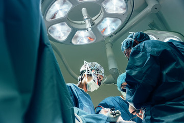 Team of Surgeons Operating.