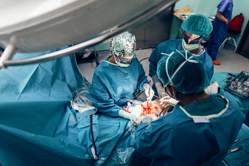 Team of Surgeons Operating.