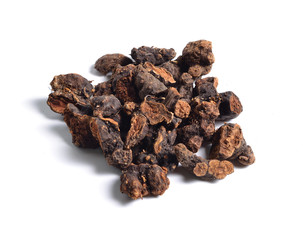 Dried medicinal herbs raw materials isolated on white. Root of Alpinia officinarum, lesser galangal