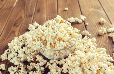 Salt popcorn on the wooden table