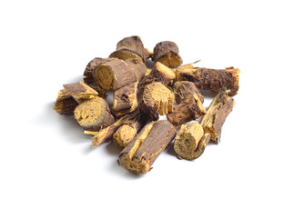 Dried medicinal herbs raw materials isolated on white. Root of Glycyrrhiza.