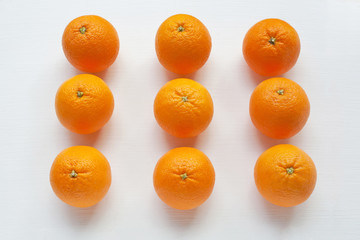 Fresh orange citrus fruit on white background.