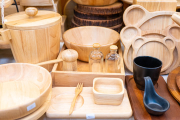 Various of wooden utensils for sale in store