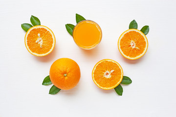 Fresh orange citrus fruit with leaves isolated on white
