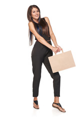 Full length woman carrying heavy carton brown shopping bag with empty copy space