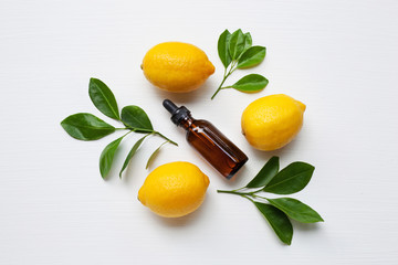 Fresh lemon with lemon essential oil.