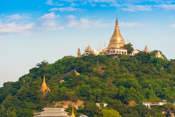 MANDALAY, MYANMAR - DECEMBER 1, 2016: Golden Pagoda in Sagaing hill, Burma. Copy space for text.