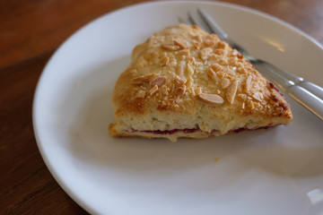 Scones with strawberry jam and cream.