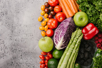 Different tasty vegetables on rough background