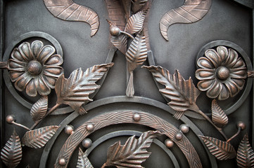 decoration with forged elements of metal gates, flowers and leaves