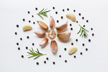 Garlic with rosemary and peppercorn isolated on white background