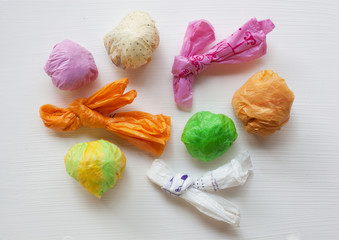 Colorful crumpled plastic bag on white background.
