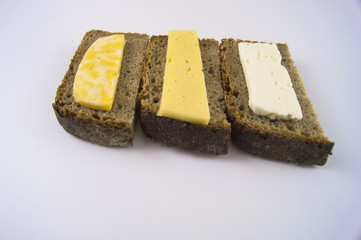 Dietary food. Black bread with different kinds of cheese