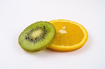 Fototapeta na wymiar Closeup of a piece of orange and kiwi on a light background