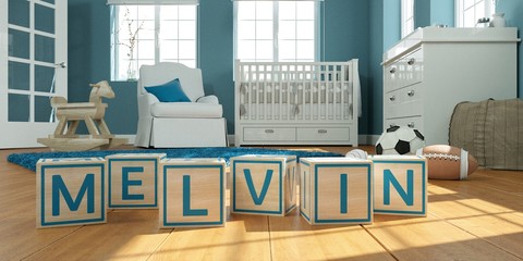 The name melvin written with wooden toy cubes in children's room