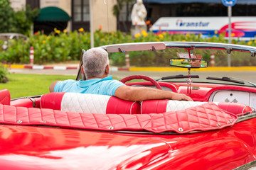 CUBA, HAVANA - MAY 5, 2017: American red retro cabriolet on city street. Close-up.
