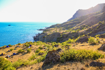 Fototapeta na wymiar Sea and Mountains landscape at Cape Meganom, the east coast of the peninsula of Crimea. Beautiful nature, Colorful background.