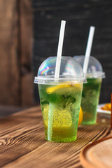 fresh mint lemonade - cold drink (a plastic glass of drink) - mojito