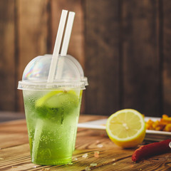 fresh mint lemonade - cold drink (a plastic glass of drink) - mojito