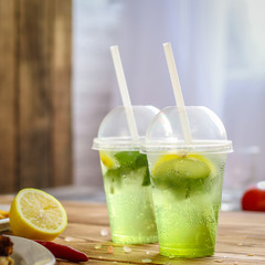 fresh mint lemonade - cold drink (a plastic glass of drink) - mojito