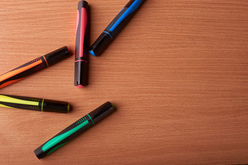 colored markers on the school table