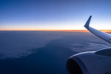 airplane in the sky during sunset