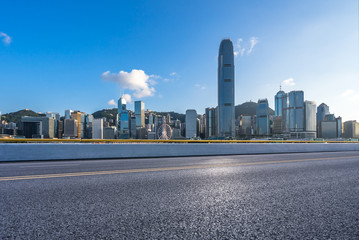 city skyline with asphalt road